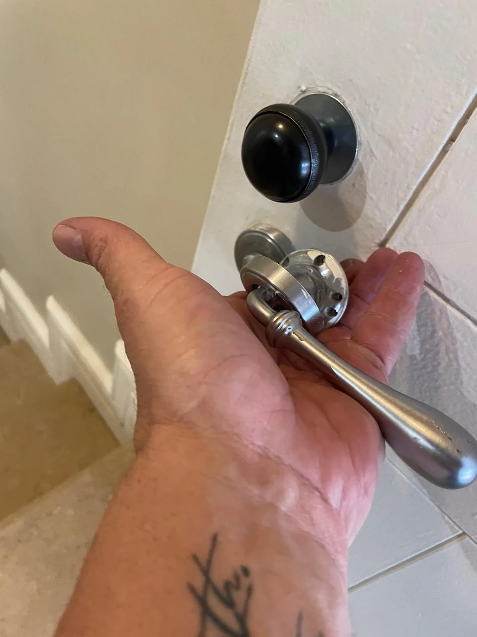 Working on a door handle and lock